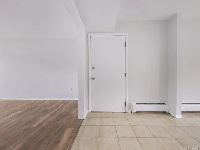 a bed room with a bed and a night stand