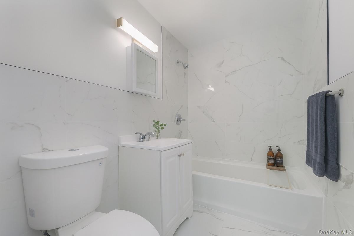 27 Tanager Road, Unit 2701 Monroe, NY 10950 - Photo 17 of 23 a bathroom with a sink a toilet and shower