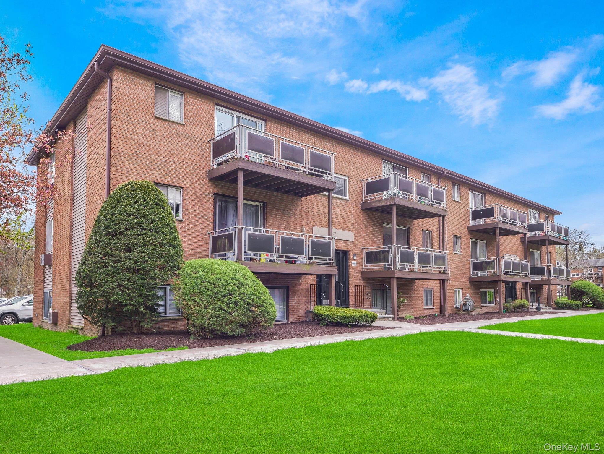 27 Tanager Road, Unit 2701 Monroe, NY 10950 - Photo 3 of 23 a front view of a house with a yard