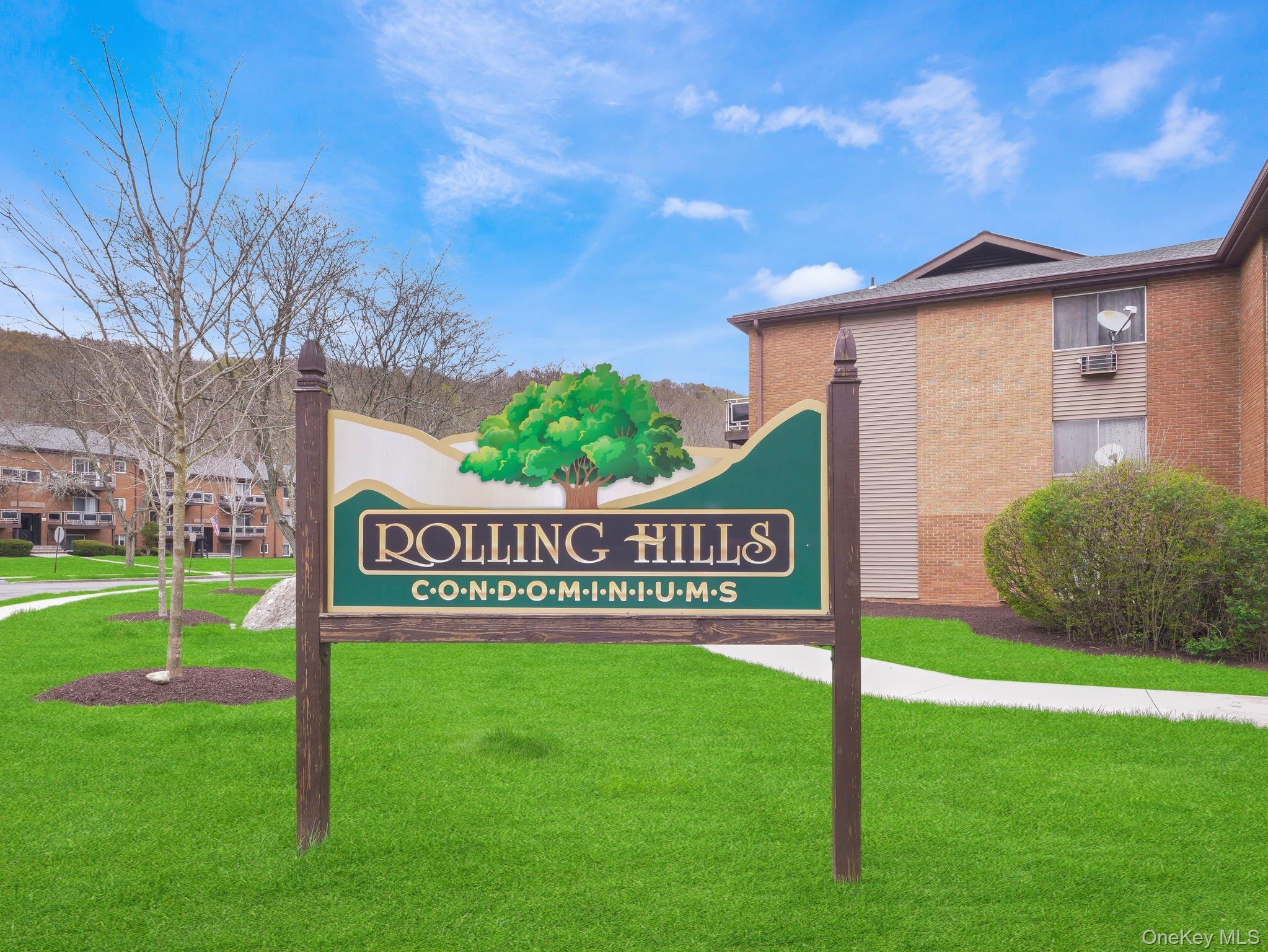 27 Tanager Road, Unit 2701 Monroe, NY 10950 - Photo 4 of 23 a sign that is sitting on the grass of a house