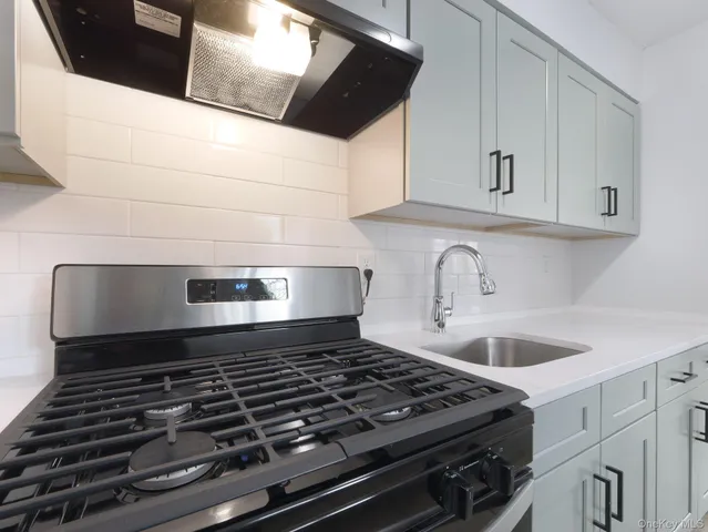a kitchen with a sink and cabinets