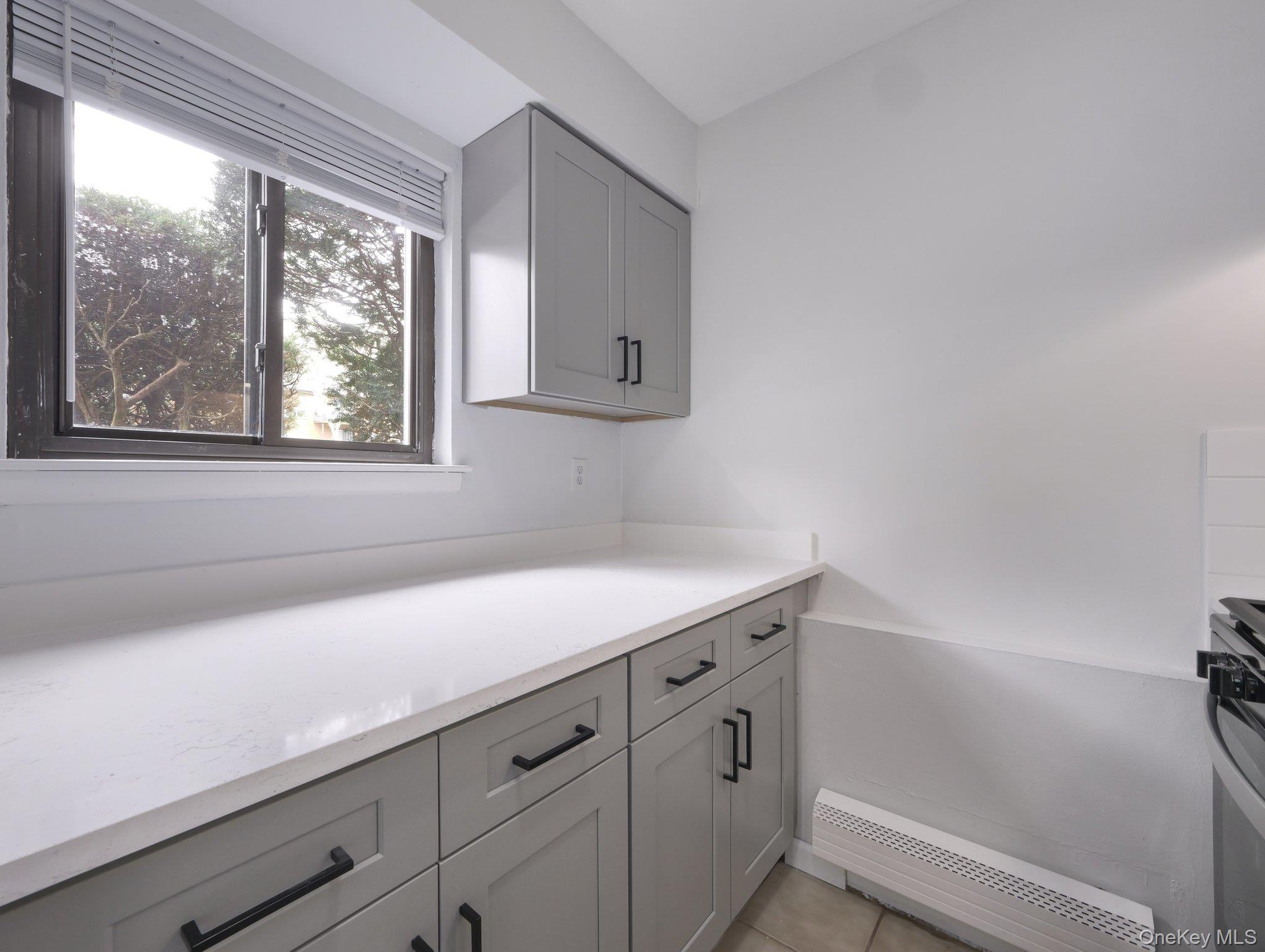 27 Tanager Road, Unit 2701 Monroe, NY 10950 - Photo 8 of 23 a kitchen with a sink and a window