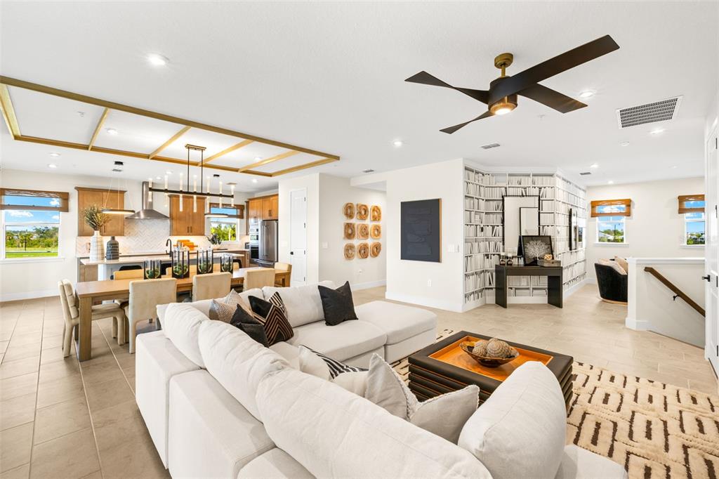 12829 Jade Empress Loop, Unit 201 Venice, FL 34293 - Photo 8 of 40 a living room with furniture and kitchen view