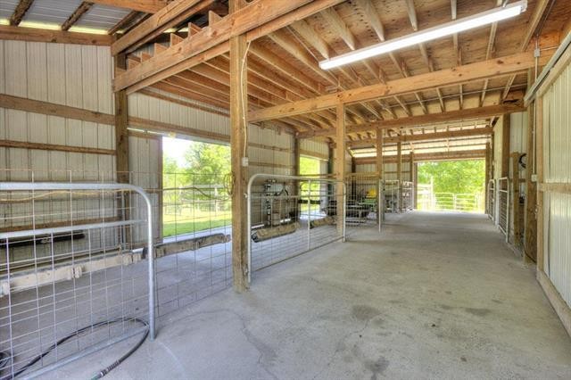868 Reed Road Ten Mile, TN 37880 - Photo 39 of 40 a view of an empty room with wooden floor and windows