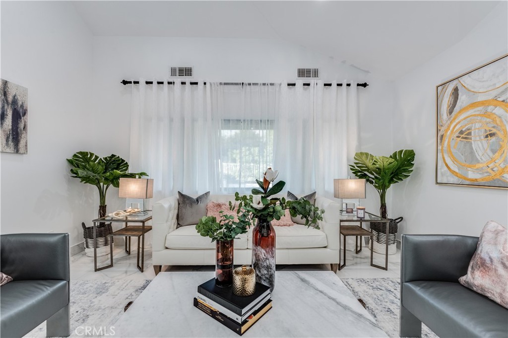 3890 Shadow Grove Road Pasadena, CA 91107 - Photo 11 of 63 a living room with furniture potted plant and a rug