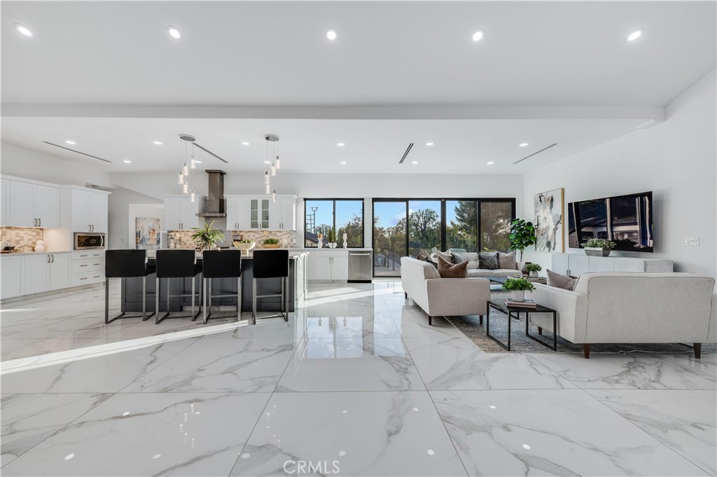 3890 Shadow Grove Road Pasadena, CA 91107 - Photo 15 of 63 a living room with furniture and a flat screen tv