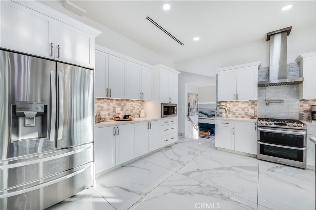 3890 Shadow Grove Road Pasadena, CA 91107 - Photo 18 of 63 a kitchen with granite countertop cabinets and stainless steel appliances