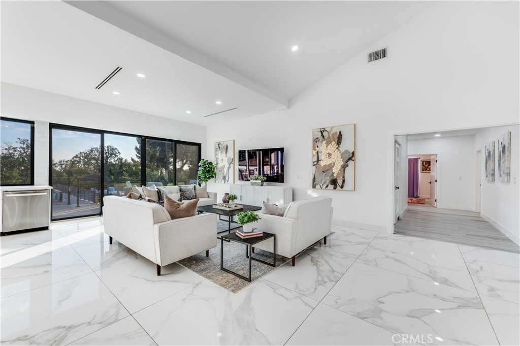3890 Shadow Grove Road Pasadena, CA 91107 - Photo 20 of 63 a living room with furniture large window and a table