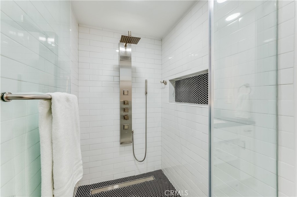 3890 Shadow Grove Road Pasadena, CA 91107 - Photo 22 of 63 a bathroom with a shower and a mirror