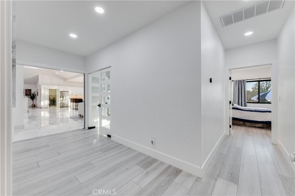 3890 Shadow Grove Road Pasadena, CA 91107 - Photo 29 of 63 wooden floor and windows in a room