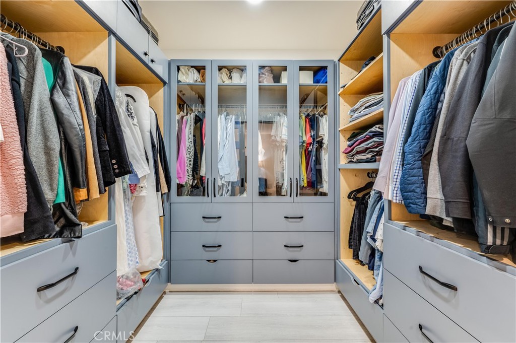 3890 Shadow Grove Road Pasadena, CA 91107 - Photo 39 of 63 a view of walk in closet with clothes and shoes