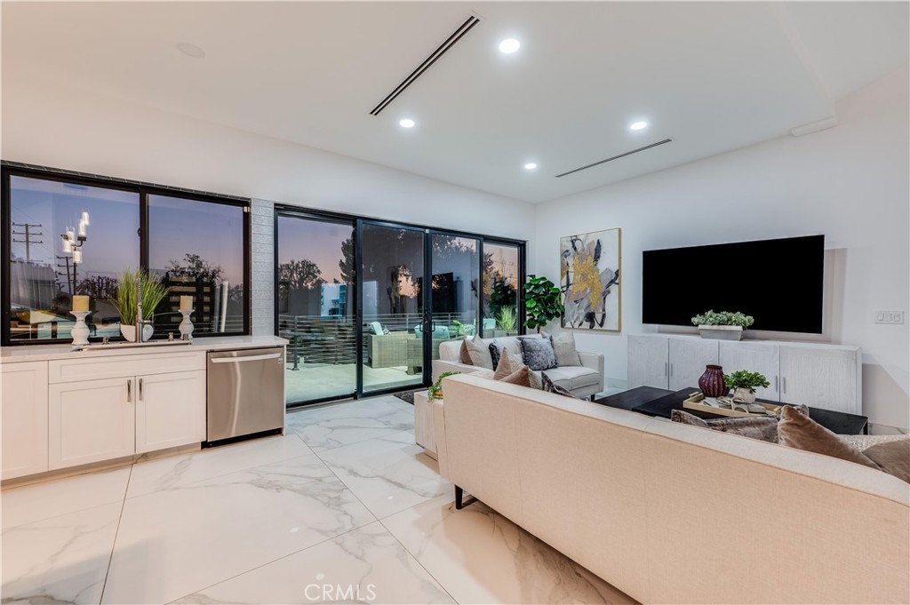 3890 Shadow Grove Road Pasadena, CA 91107 - Photo 49 of 63 a living room with furniture and a flat screen tv