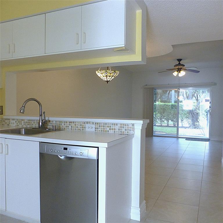 Weston Weston, FL 33326 - Photo 3 of 13 a kitchen with a sink and cabinets