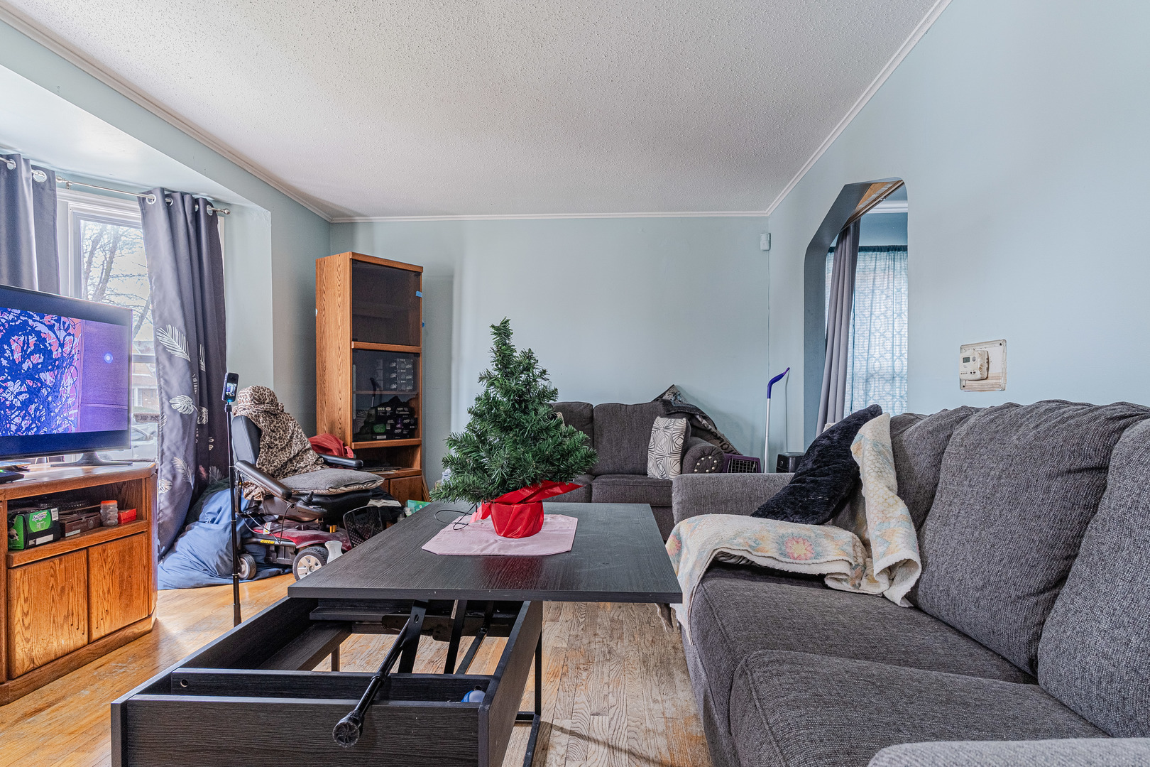 8026 South Fairfield Avenue Chicago, IL 60652 - Photo 3 of 18 a living room with furniture and a flat screen tv