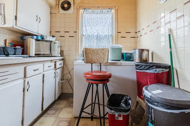 a kitchen with stainless steel appliances a stove a sink and a refrigerator