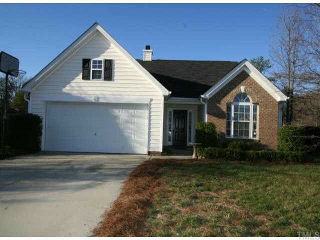 4409 Drewbridge Way Raleigh, NC 27604 - Photo 1 of 11 a front view of a house with a yard