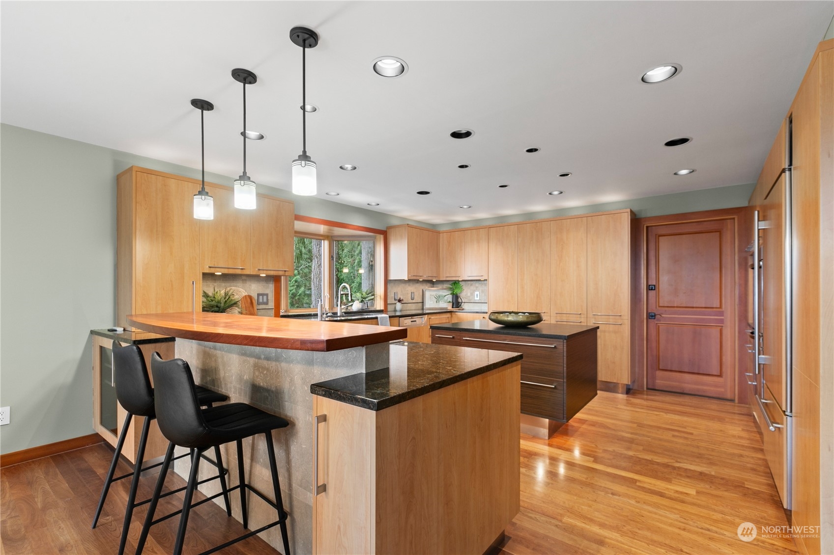 629 Fieldston Road Bellingham, WA 98225 - Photo 13 of 40 a kitchen with stainless steel appliances granite countertop a sink a stove and a refrigerator