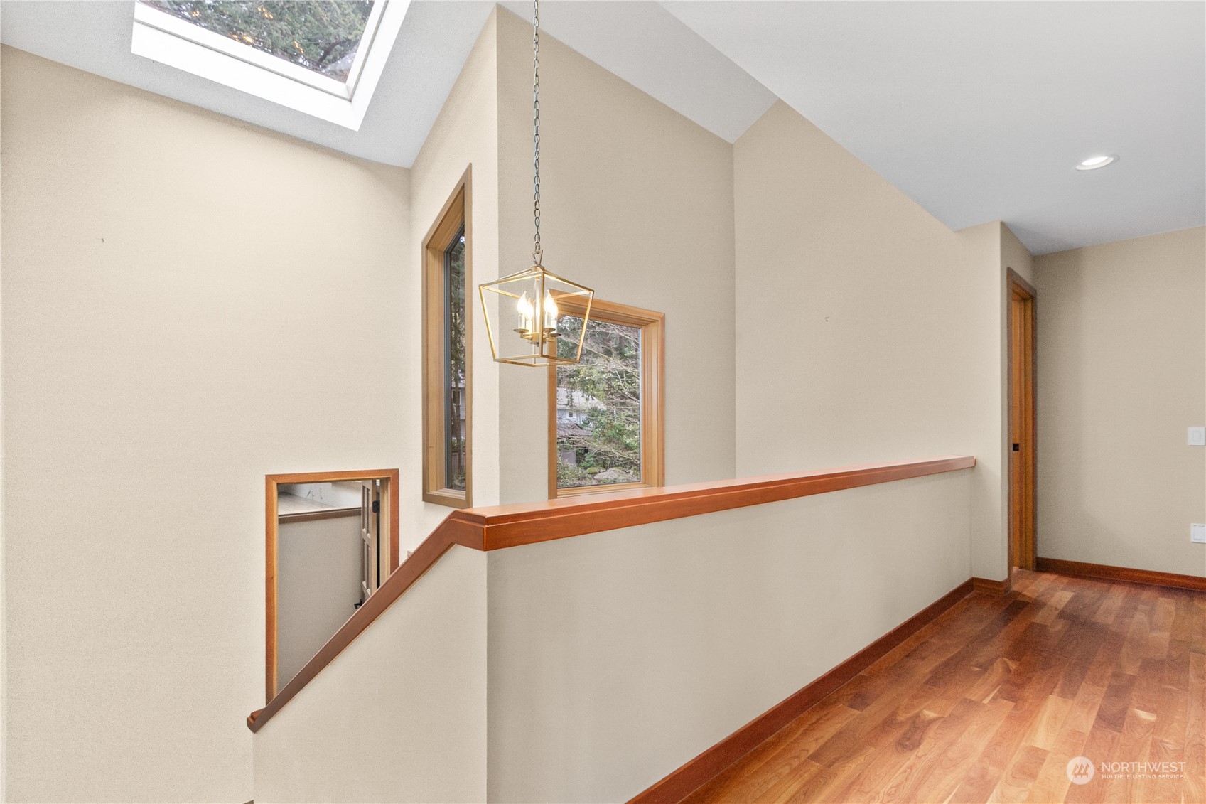 629 Fieldston Road Bellingham, WA 98225 - Photo 33 of 40 a view of a hallway with wooden floor and staircase