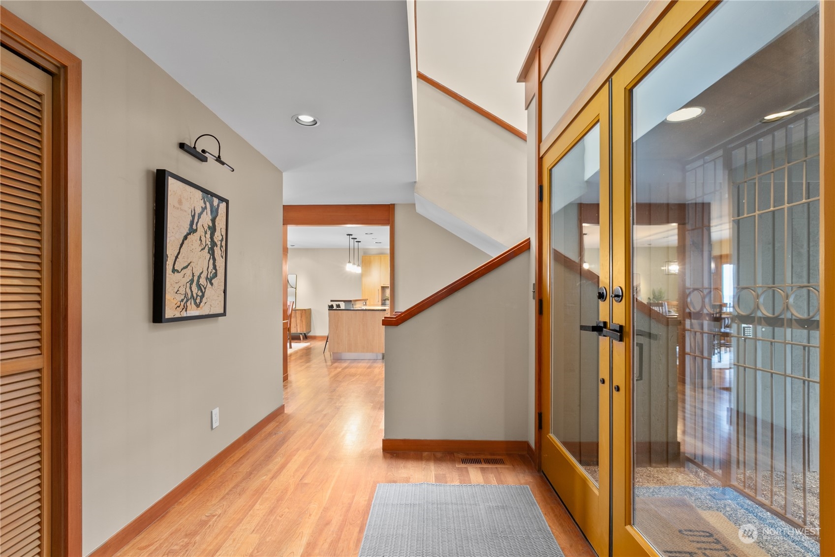 629 Fieldston Road Bellingham, WA 98225 - Photo 4 of 40 a view of a hallway with wooden floor and staircase