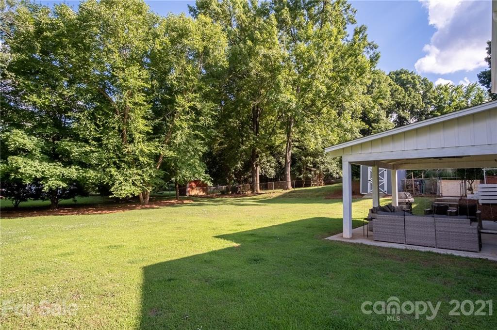 5619 Londonderry Road Charlotte, NC 28210 - Photo 22 of 23 a view of a house with a yard balcony and sitting area