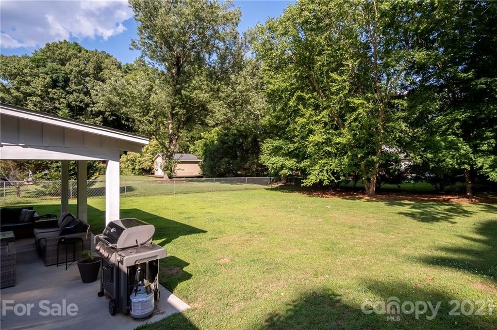 5619 Londonderry Road Charlotte, NC 28210 - Photo 23 of 23 a view of a patio with swimming pool table and chairs