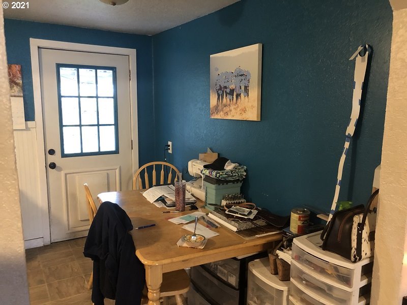 323 4th Avenue Riddle, OR 97469 - Photo 8 of 22 a view of a workspace with furniture and window