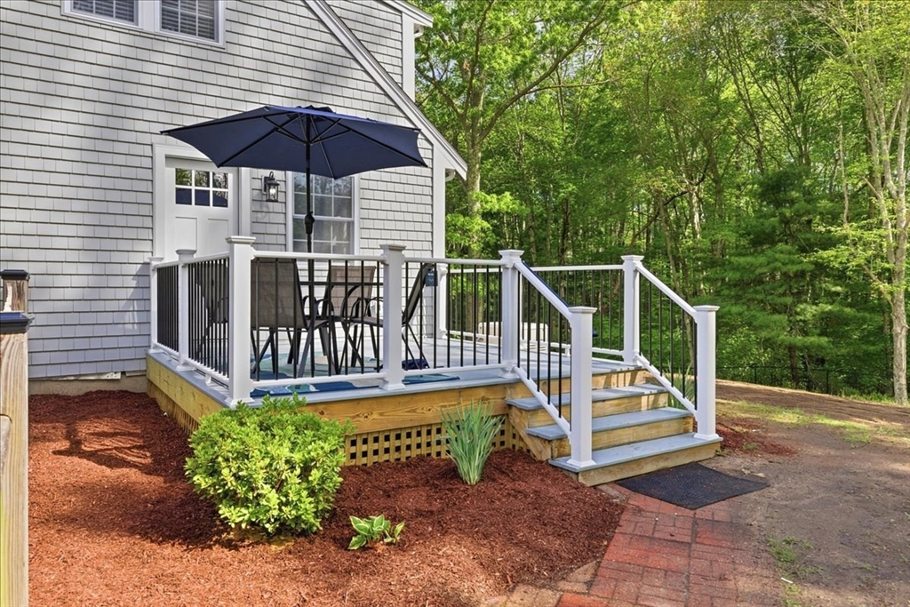 16 Churchill Road Plympton, MA 02367 - Photo 3 of 42 a view of a chair with a table and chairs under an umbrella