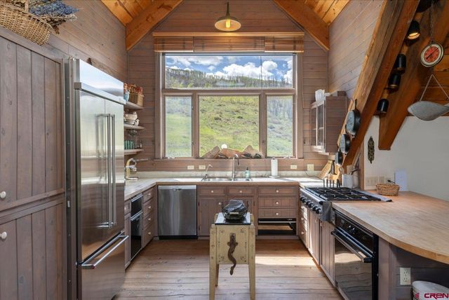 a kitchen with lots of counter top space and appliances