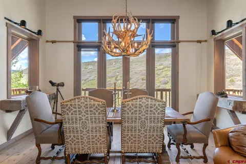 a view of a dining room with furniture window and outside view
