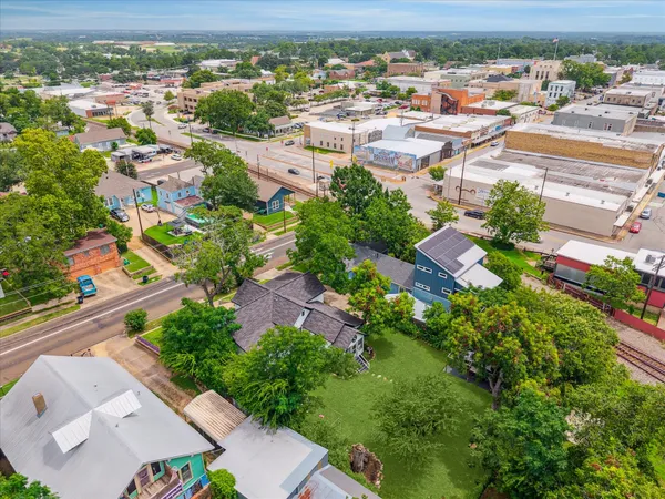 an aerial view of residential houses with outdoor space