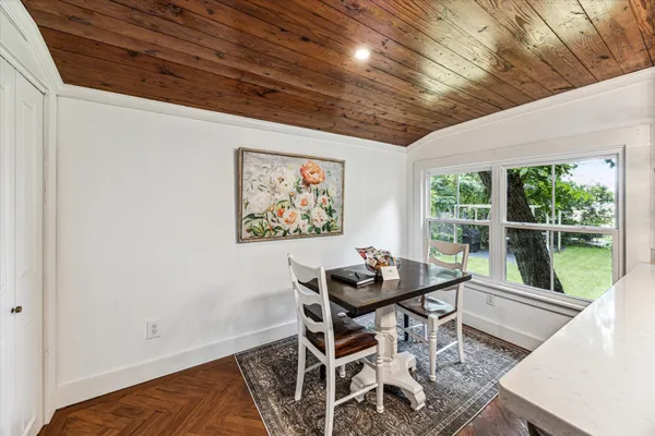 a dining room with furniture and window