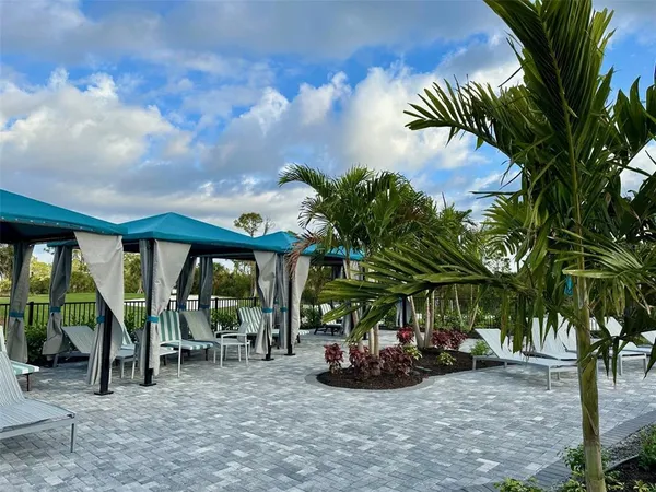 a view of room with stairs and a wooden ceiling fan