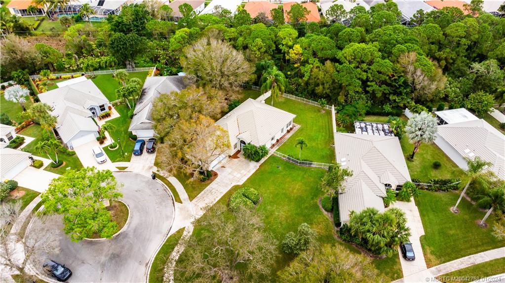 7199 Southeast Bitterroot Circle Hobe Sound, FL 33455 - Photo 4 of 28 an aerial view of a house with a yard and lake view