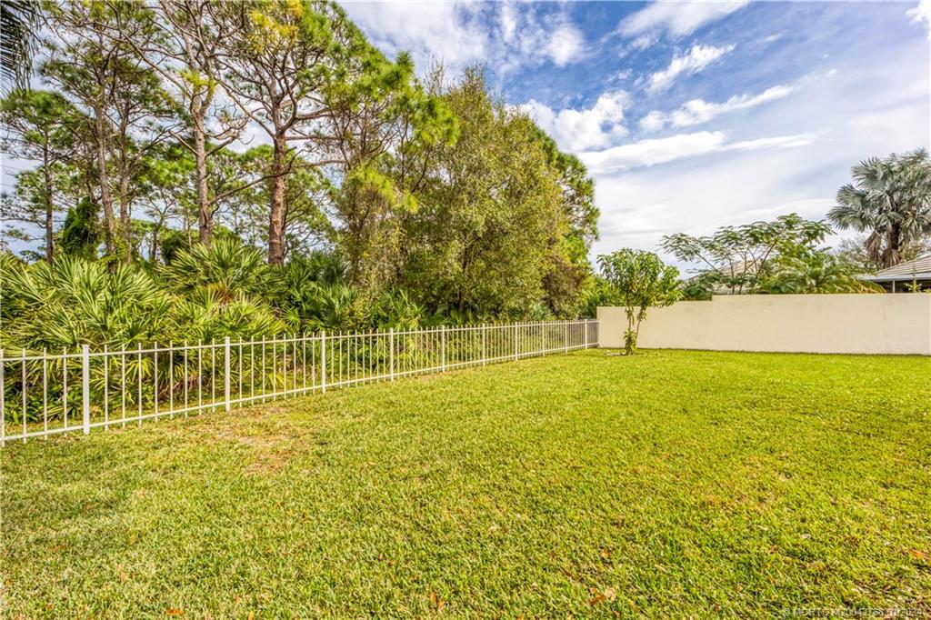 7199 Southeast Bitterroot Circle Hobe Sound, FL 33455 - Photo 10 of 28 a view of yard with swimming pool and green space