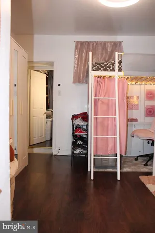 a view of a room with wooden floor and windows