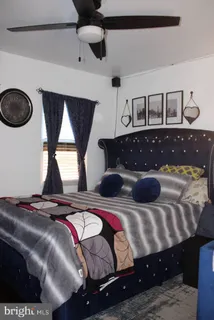 a living room with a bed