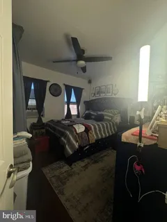 a bedroom with furniture and a bed