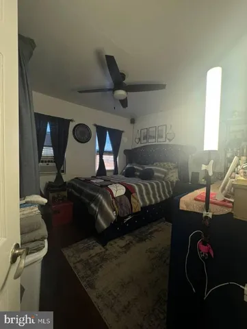 a bedroom with furniture and a bed