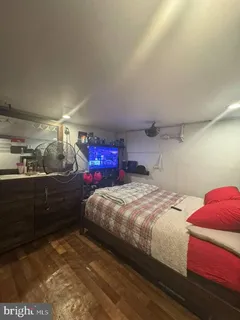 a bedroom with a bed and cabinets