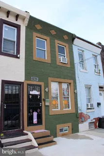 a front view of a house with a entryway