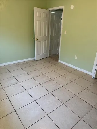 a room with washing machine and a shower