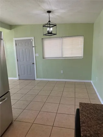 a view of a kitchen with microwave and cabinets