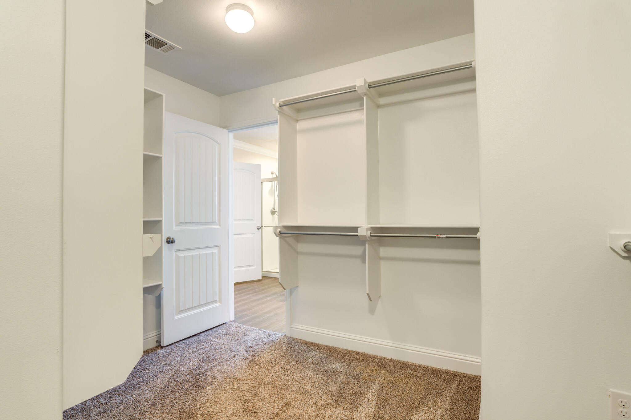 7535 103rd Street Lubbock, TX 79424 - Photo 26 of 35 a view of walk in closet with empty racks