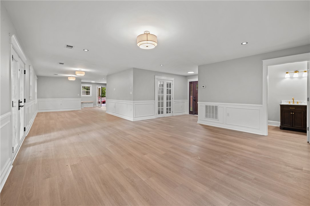 309 Woodland Way Clemson, SC 29631 - Photo 17 of 43 This expansive room features light wood flooring and wainscoting, creating a bright and welcoming atmosphere.