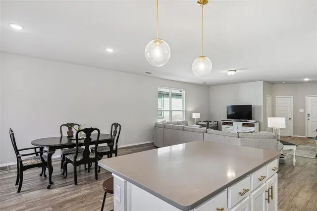 a view of kitchen and dining area with furniture