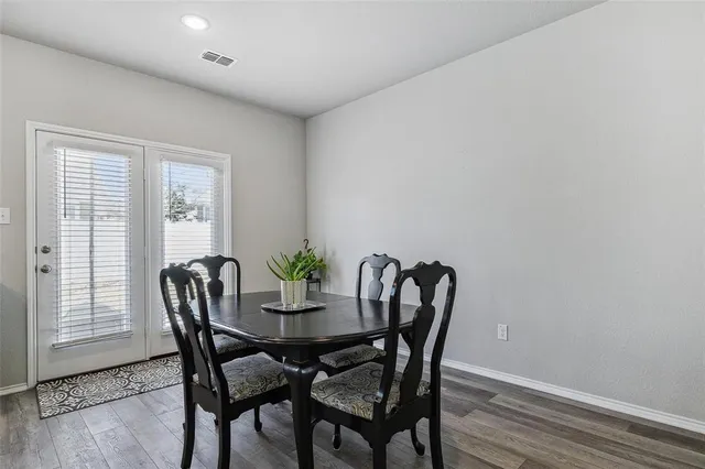 a view of a dining room with furniture and window