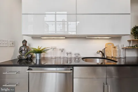 a kitchen with a sink and cabinets