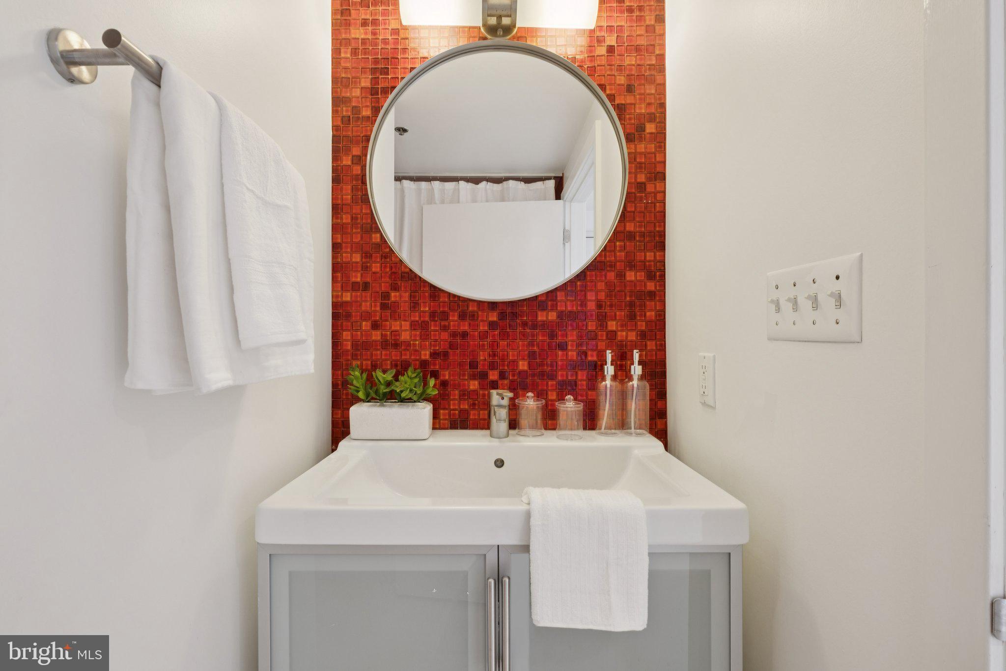 1234 Hamilton Street, Unit 102 Philadelphia, PA 19123 - Photo 7 of 25 a bathroom with a sink and a mirror
