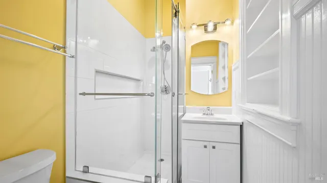 a view of dirt field with trees in the background