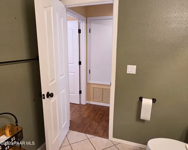 a bathroom with a granite countertop sink